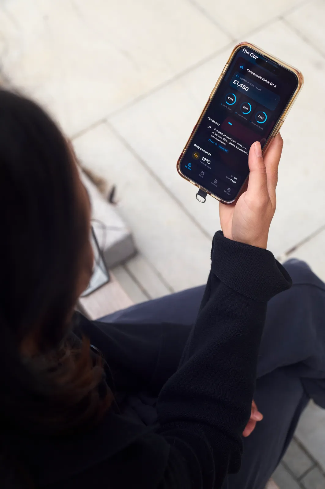 A cyclist checking their bike's health score and next service in the Tyred app.